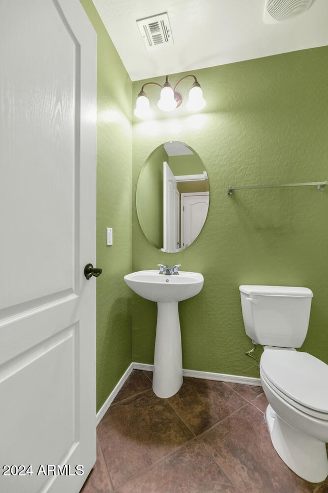 bathroom with tile patterned floors, toilet, and sink