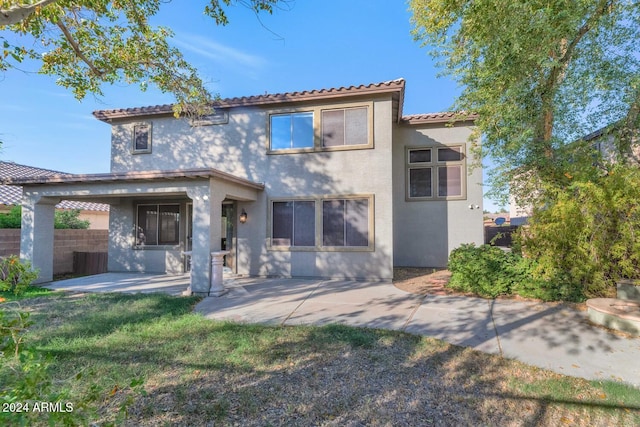 rear view of house with a patio