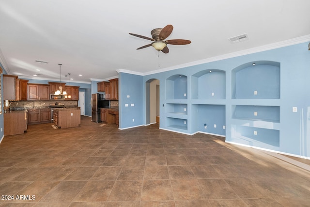 unfurnished living room with dark tile patterned flooring, built in features, ceiling fan, and crown molding