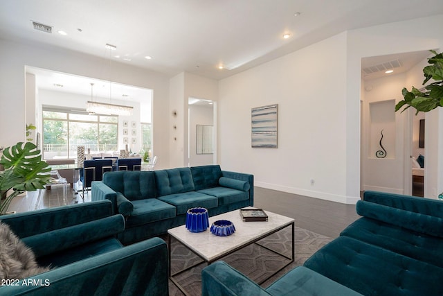 living area with baseboards, visible vents, recessed lighting, and dark wood-type flooring