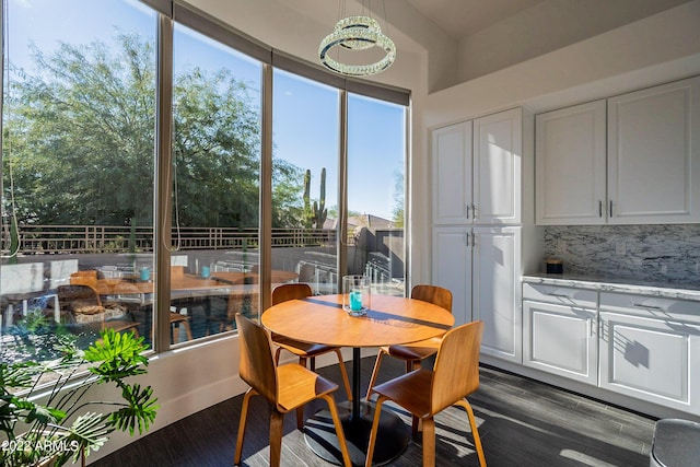 dining room with dark wood-type flooring