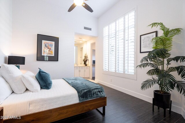 bedroom featuring dark wood-style flooring, baseboards, multiple windows, and visible vents