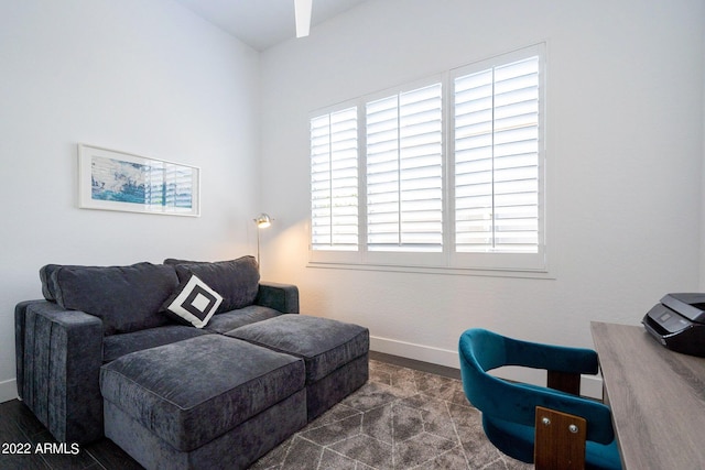 living area featuring baseboards
