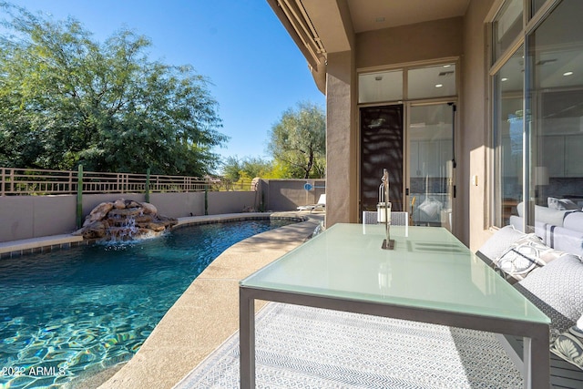 view of pool featuring a fenced in pool and a fenced backyard