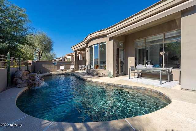 view of pool with a patio, a fenced in pool, and a fenced backyard