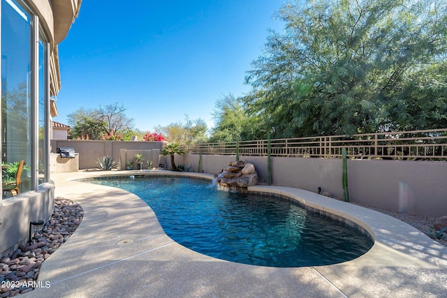 view of pool featuring a fenced in pool, a fenced backyard, and a patio area