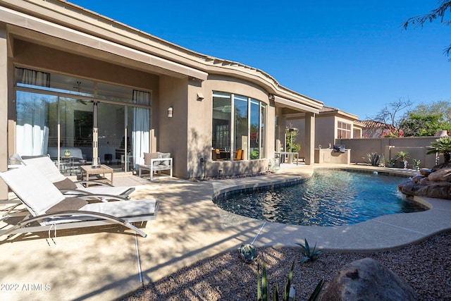 view of pool featuring fence, a fenced in pool, and a patio area