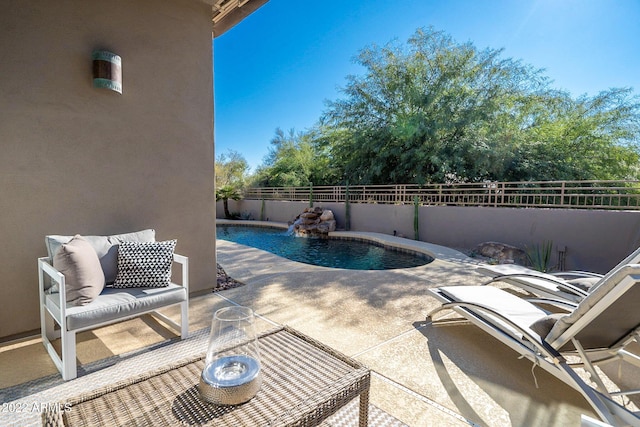 view of swimming pool featuring a fenced backyard, a patio, and a fenced in pool