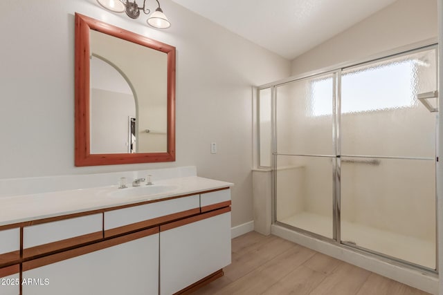 15087 N 86th Dr, Peoria, AZ 85381 - full bath featuring lofted ceiling, wood finished floors, a stall shower, and vanity