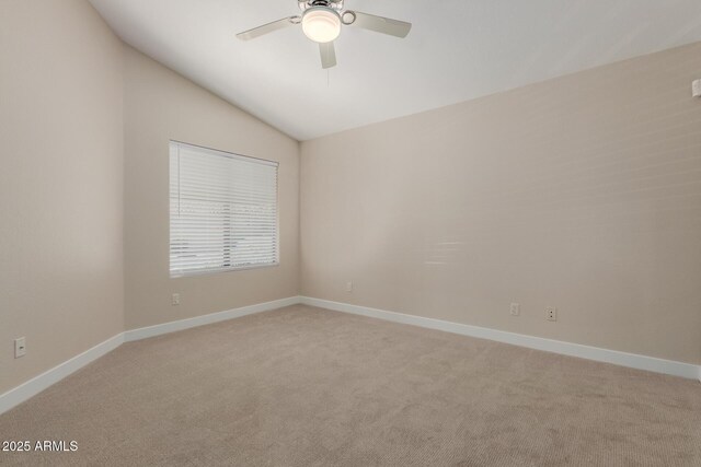 15087 N 86th Dr, Peoria, AZ 85381 - unfurnished room featuring baseboards, ceiling fan, vaulted ceiling, and light carpet