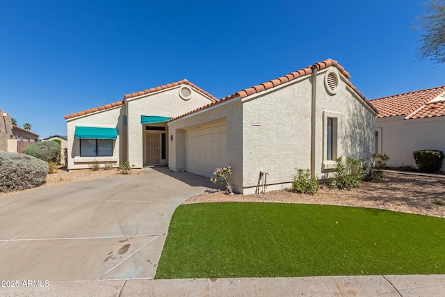 15087 N 86th Dr, Peoria, AZ 85381 - mediterranean / spanish-style home with a tiled roof, stucco siding, driveway, and a garage