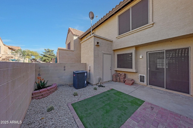 view of yard featuring a patio and central air condition unit