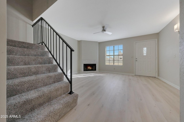 entryway with ceiling fan and light wood-type flooring