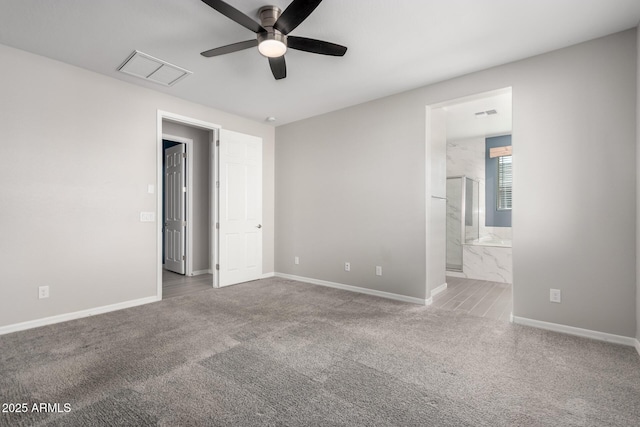 empty room with ceiling fan and carpet flooring