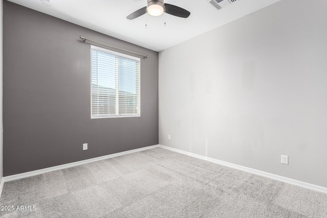 empty room featuring ceiling fan and carpet floors