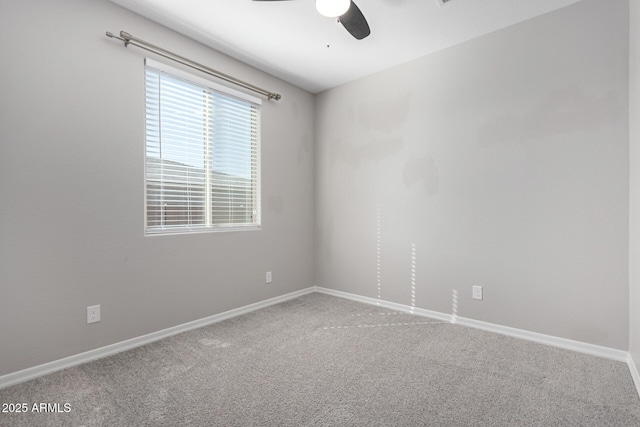 empty room with ceiling fan and carpet flooring