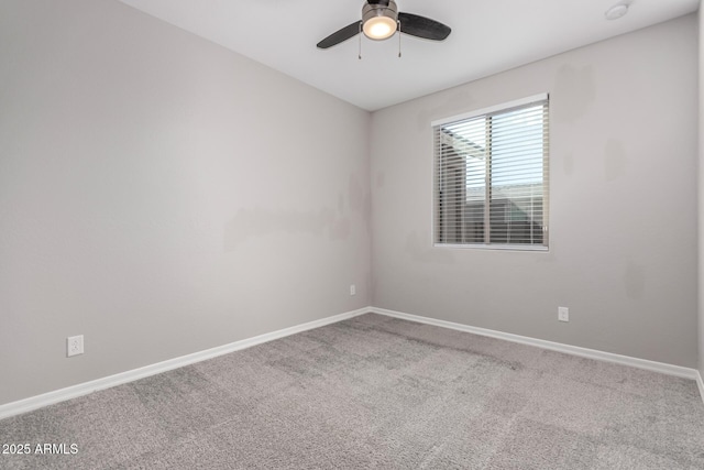 unfurnished room with ceiling fan and carpet flooring