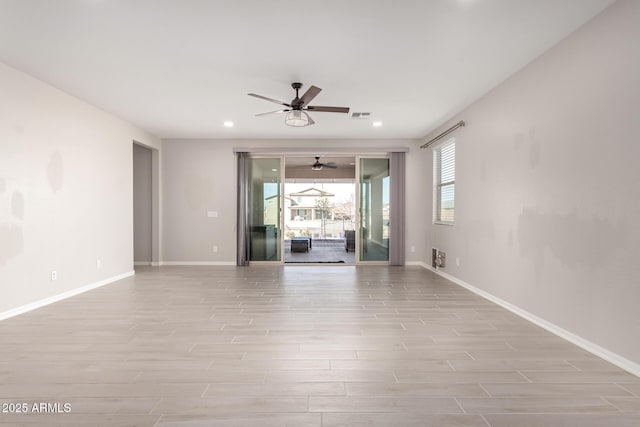 unfurnished living room featuring ceiling fan