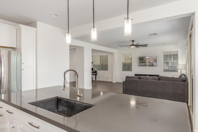 23042 E Excelsior Ave, Queen Creek, AZ 85142 - kitchen featuring dark countertops, a ceiling fan, hanging light fixtures, white cabinets, and recessed lighting