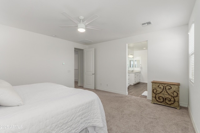 23042 E Excelsior Ave, Queen Creek, AZ 85142 - carpeted bedroom with connected bathroom and a ceiling fan