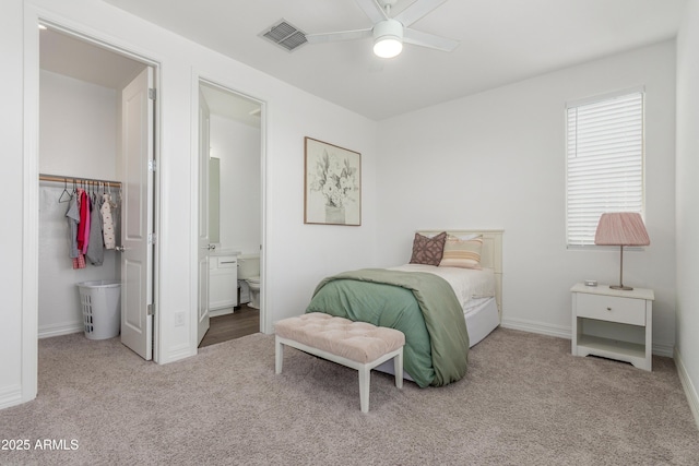 23042 E Excelsior Ave, Queen Creek, AZ 85142 - bedroom featuring carpet, a spacious closet, a closet, connected bathroom, and ceiling fan