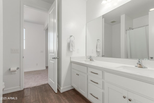 23042 E Excelsior Ave, Queen Creek, AZ 85142 - full bathroom with double vanity and wood finished floors