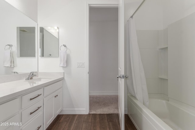 23042 E Excelsior Ave, Queen Creek, AZ 85142 - full bathroom featuring vanity, shower / bath combo, and wood finished floors