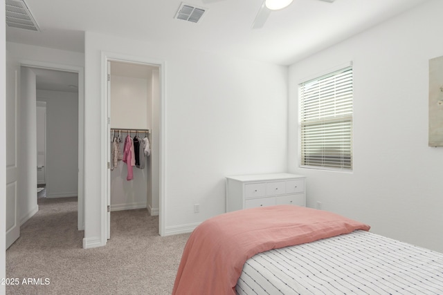 23042 E Excelsior Ave, Queen Creek, AZ 85142 - bedroom with light carpet, a walk in closet, a ceiling fan, and a closet