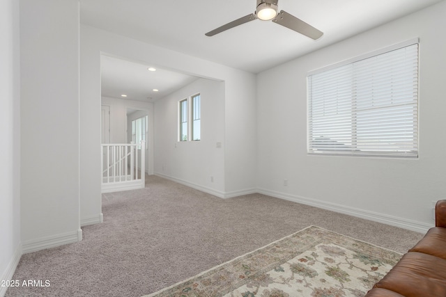 23042 E Excelsior Ave, Queen Creek, AZ 85142 - unfurnished living room with carpet floors, a ceiling fan, and recessed lighting