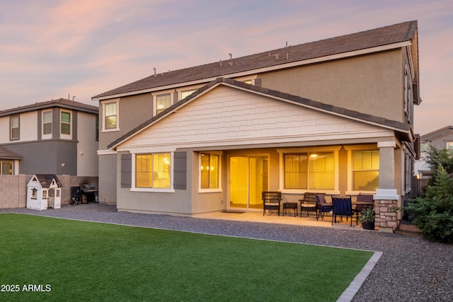 23042 E Excelsior Ave, Queen Creek, AZ 85142 - rear view of property with a patio, a lawn, and stucco siding