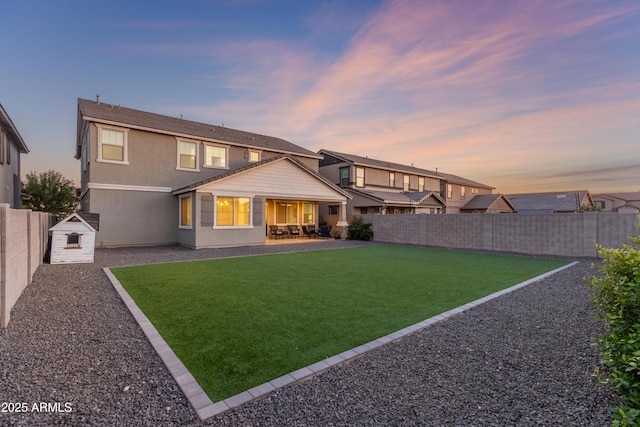 23042 E Excelsior Ave, Queen Creek, AZ 85142 - back of house featuring a fenced backyard, a patio, and stucco siding