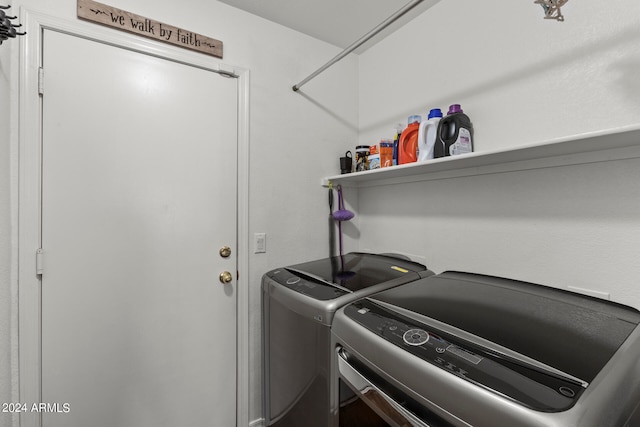 clothes washing area with separate washer and dryer