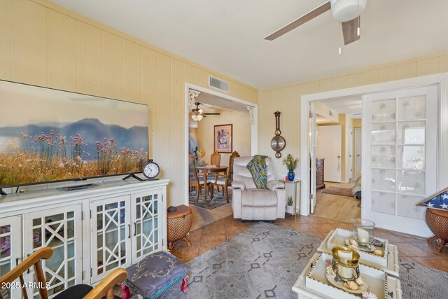 17024 N Pinion Ln, Sun City, AZ 85373 - living room with tile patterned floors, visible vents, and ceiling fan