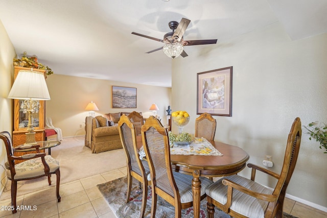17024 N Pinion Ln, Sun City, AZ 85373 - dining room with light tile patterned floors, baseboards, and ceiling fan