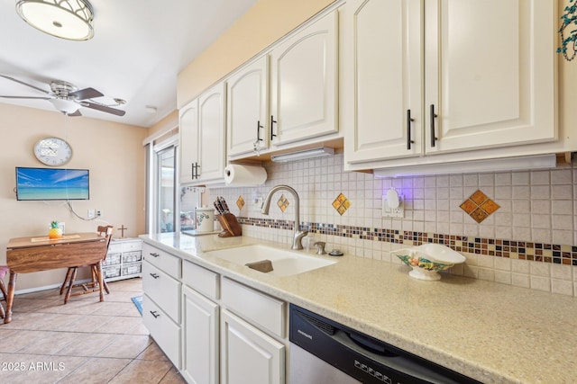 17024 N Pinion Ln, Sun City, AZ 85373 - kitchen with a sink, a ceiling fan, tasteful backsplash, dishwasher, and light tile patterned floors
