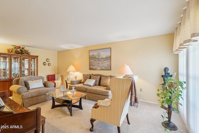 17024 N Pinion Ln, Sun City, AZ 85373 - living room with baseboards and light colored carpet