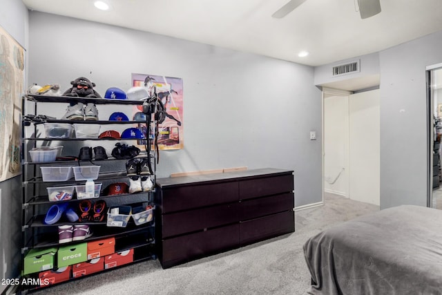 carpeted bedroom featuring recessed lighting, visible vents, and a ceiling fan