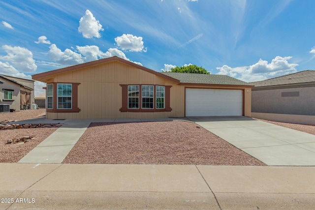 5901 E Leonora St, Mesa, AZ 85215 - view of front of home featuring an attached garage, driveway, and central AC