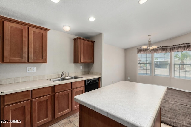 5901 E Leonora St, Mesa, AZ 85215 - kitchen featuring brown cabinetry, black dishwasher, a sink, light countertops, and a notable chandelier