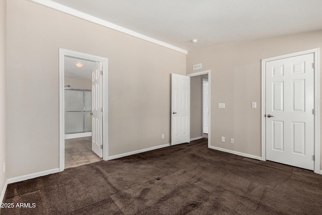 5901 E Leonora St, Mesa, AZ 85215 - unfurnished bedroom featuring baseboards, carpet flooring, ensuite bath, visible vents, and lofted ceiling