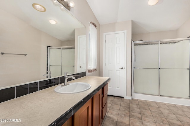 5901 E Leonora St, Mesa, AZ 85215 - bathroom featuring a stall shower, vanity, baseboards, and vaulted ceiling