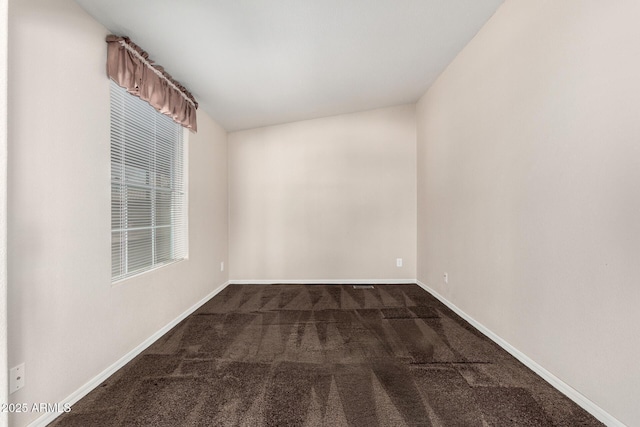 5901 E Leonora St, Mesa, AZ 85215 - unfurnished room with baseboards and dark colored carpet