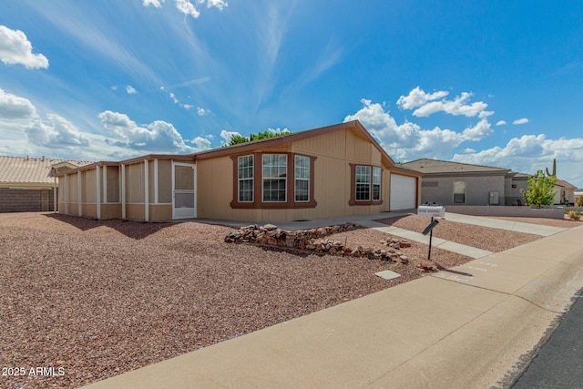 5901 E Leonora St, Mesa, AZ 85215 - view of front of house with concrete driveway and an attached garage
