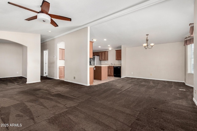 5901 E Leonora St, Mesa, AZ 85215 - unfurnished living room featuring baseboards, recessed lighting, carpet floors, arched walkways, and ceiling fan with notable chandelier