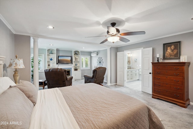 bedroom featuring decorative columns, ceiling fan, light carpet, connected bathroom, and ornamental molding