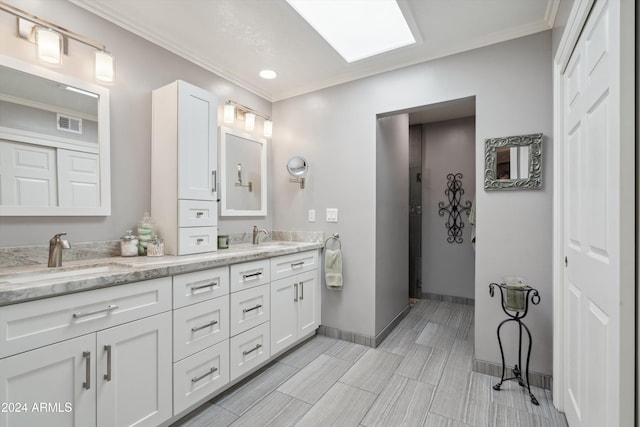 bathroom with vanity and crown molding