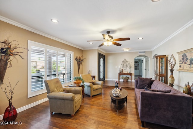 living room featuring crown molding, wood-type flooring, and ceiling fan