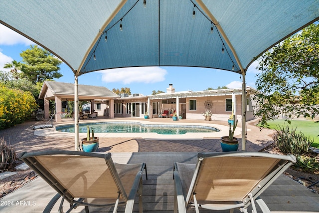 view of pool featuring a patio area