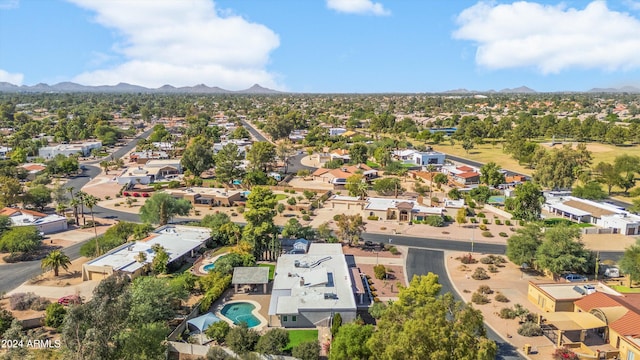 birds eye view of property featuring a mountain view