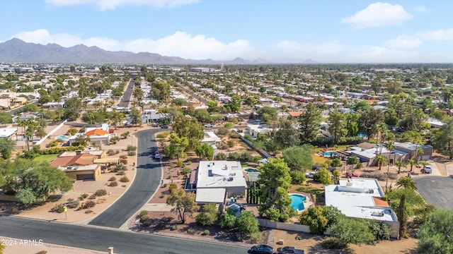 birds eye view of property featuring a mountain view